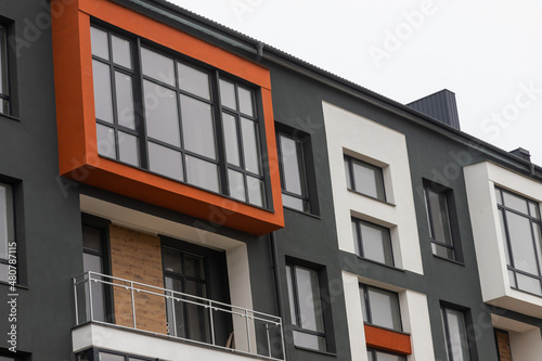 Fragment of Modern residential apartment with flat buildings exterior. Detail of New luxury house and home complex. Part of City Real estate property and condo architecture. Copy space