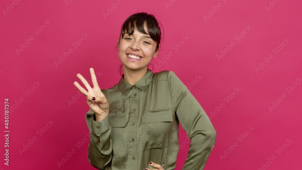 Pretty woman happy and counting with fingers over isolated background Pretty woman happy and counting with fingers over isolated background