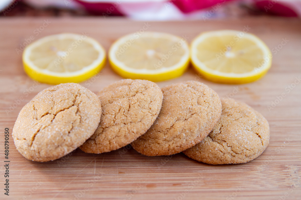 Delicious lemon sugar cookies with crinkled tops; display of home made lemon cookies Delicious lemon sugar cookies with crinkled tops; display of home made lemon cookies