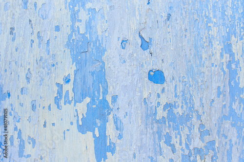Grunge wall colored blue background texture in rainbow style.