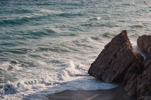 Sunset. Wild rock beach. The natural rock formation.