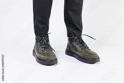New stylish men's autumn boots made of genuine leather, men's footwear on a white background. Winter men's shoes 2022