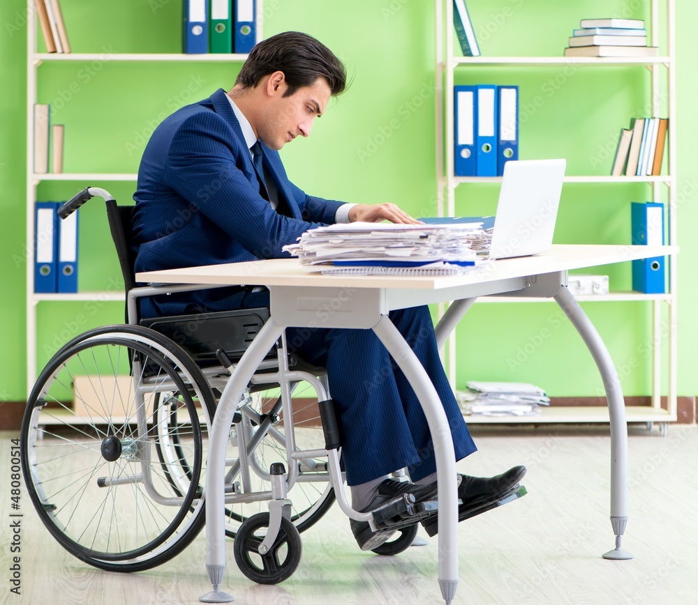 Disabled businessman working in the office Disabled businessman working in the office