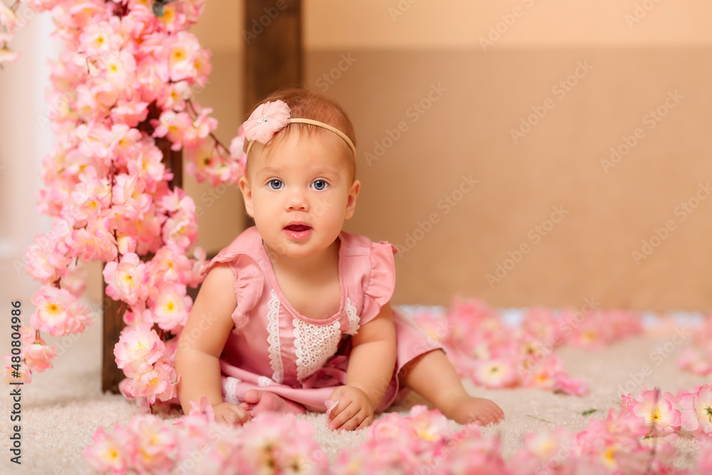 baby girl with pink flowers in pink clothes baby girl with pink flowers in pink clothes