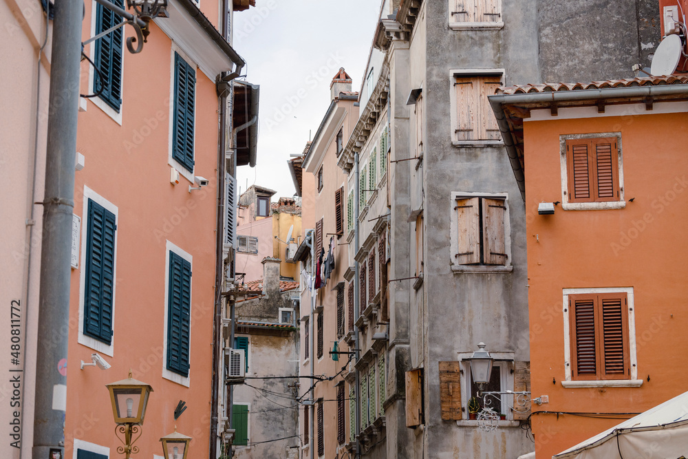 Narrow, stone paved, old streets of Rovinj, Croatia, filled with colorful, stone built houses