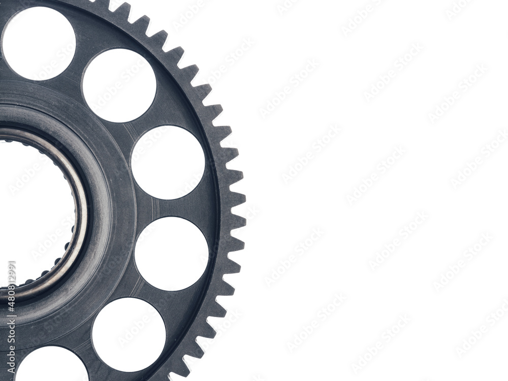 engine gear wheel with cogs, close-up view, white background with copy-space