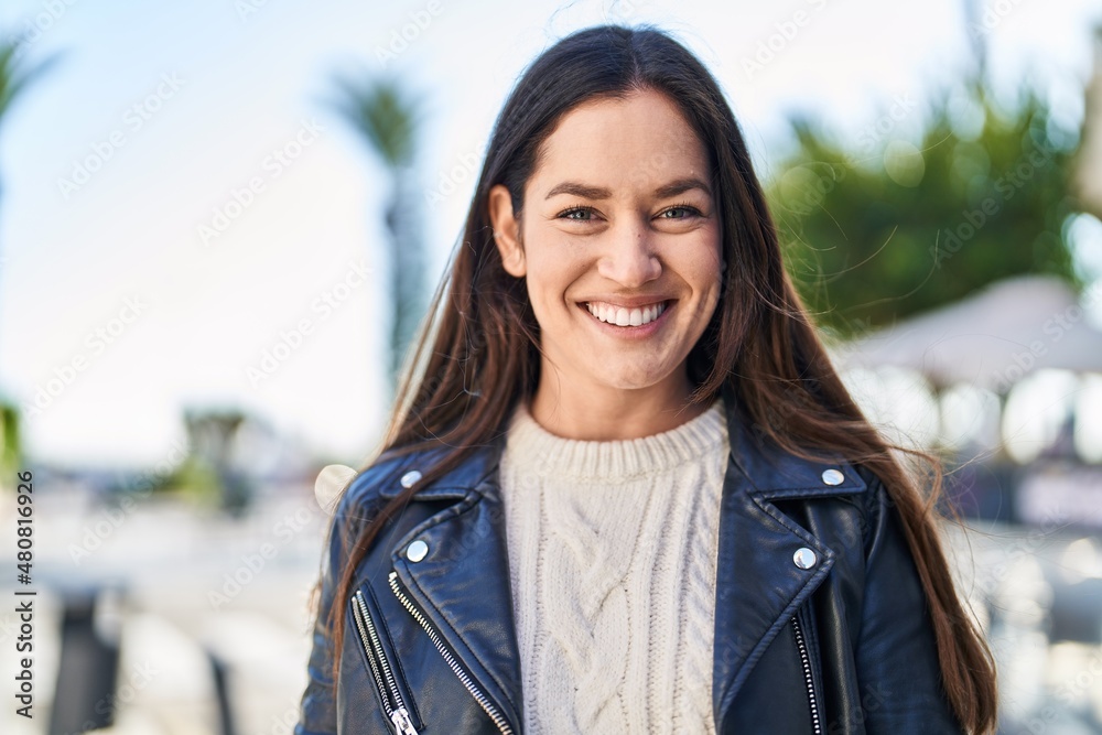 Young woman smiling confident standing at street Young woman smiling confident standing at street