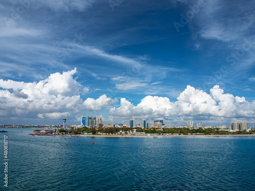Panorama view to Dar Es Salaam during daylight with cloudy dark blue sky.
