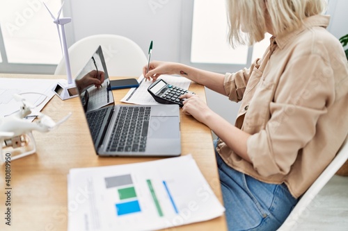 Young caucasian woman working at office