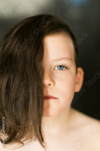 picture of the boy  long hair covered half of the face
