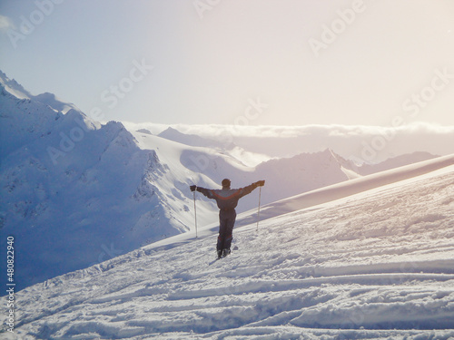 Active old aged senior experienced mature skier man in ski suit riding skies mountain peak, slope, enjoy winter extreme sport activities at alpine skiing resort. stunning panoramic © Дарья Воронцова