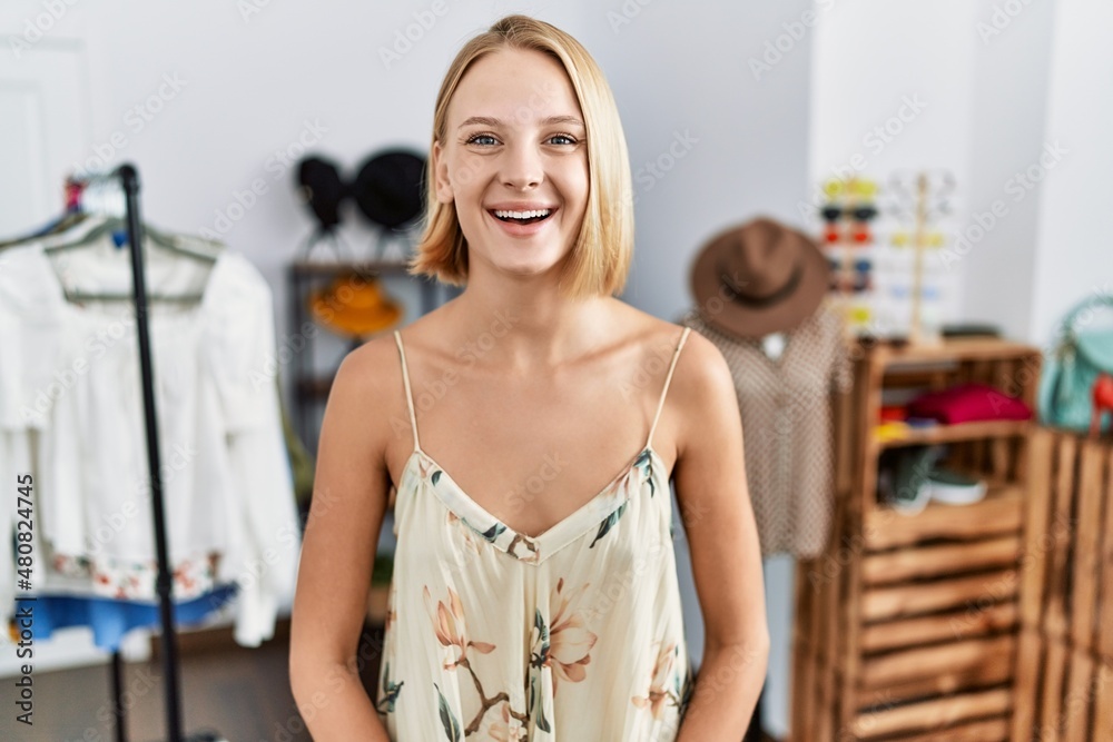 Young caucasian woman at retail shop with a happy and cool smile on face. lucky person.