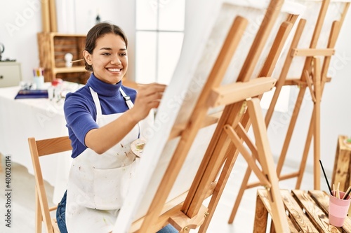 Young latin woman smiling confident drawing at art studio
