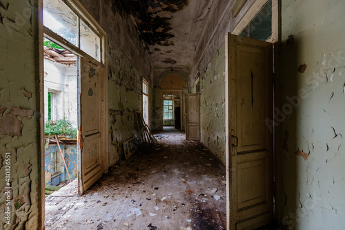 Old creepy abandoned rotten ruined mental hospital © Mulderphoto