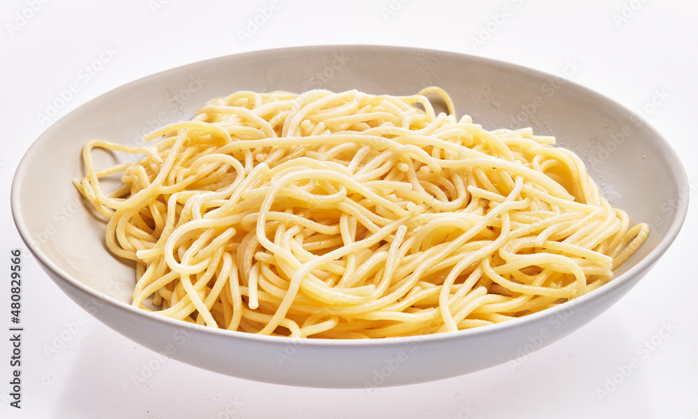 Plate of italian spaghetti pasta over white isolated background Plate of italian spaghetti pasta over white isolated background