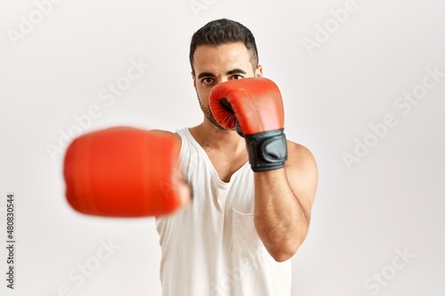 Young hispanic man boxing at clothing store © Krakenimages.com
