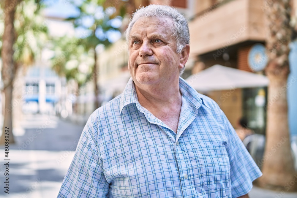 Middle age grey-haired man smiling confident walking at street Middle age grey-haired man smiling confident walking at street