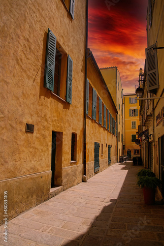Fototapeta Naklejka Na Ścianę i Meble -   Pastel buildings on narrow street of Ajaccio