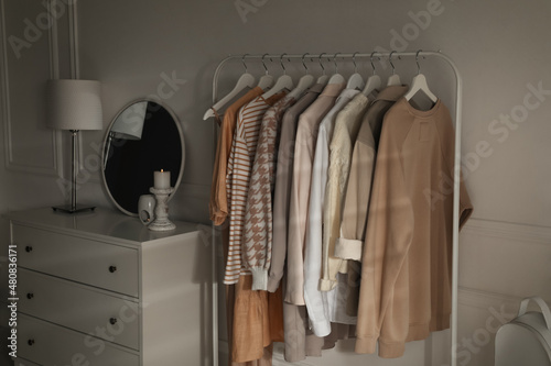 Modern dressing room interior with rack of stylish clothes © New Africa