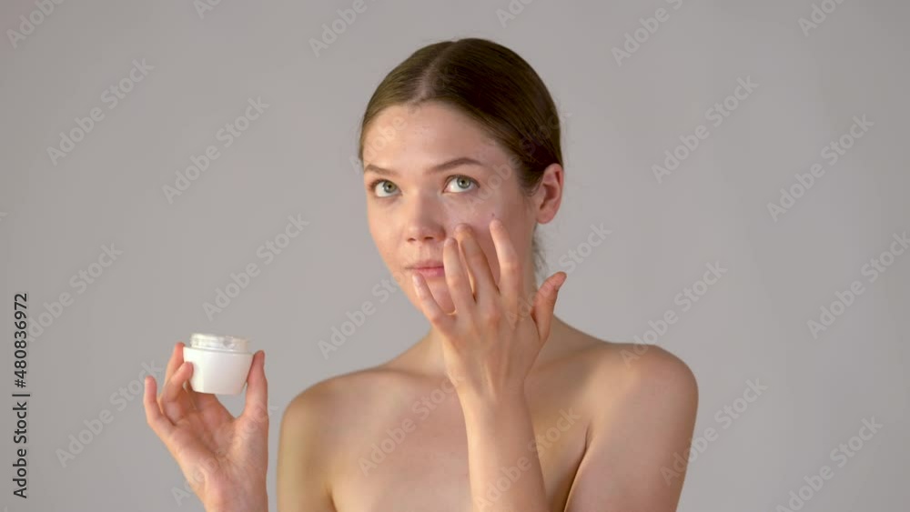 beauty and skincare. portrait attractive smiling woman holding skin care cream isolated on white background. Healthy skin care treatment concept beauty and skincare. portrait attractive smiling woman holding skin care cream isolated on white background. Healthy skin care treatment concept