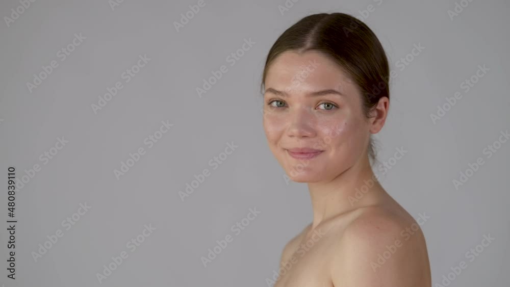 Close-up portrait of joyful girl looking at camera, isolated on white background. Skin care concept. Close-up portrait of joyful girl looking at camera, isolated on white background. Skin care concept.