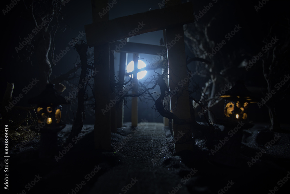 Creative artwork decoration. Abstract Japanese style wooden tunnel at night. Selective focus