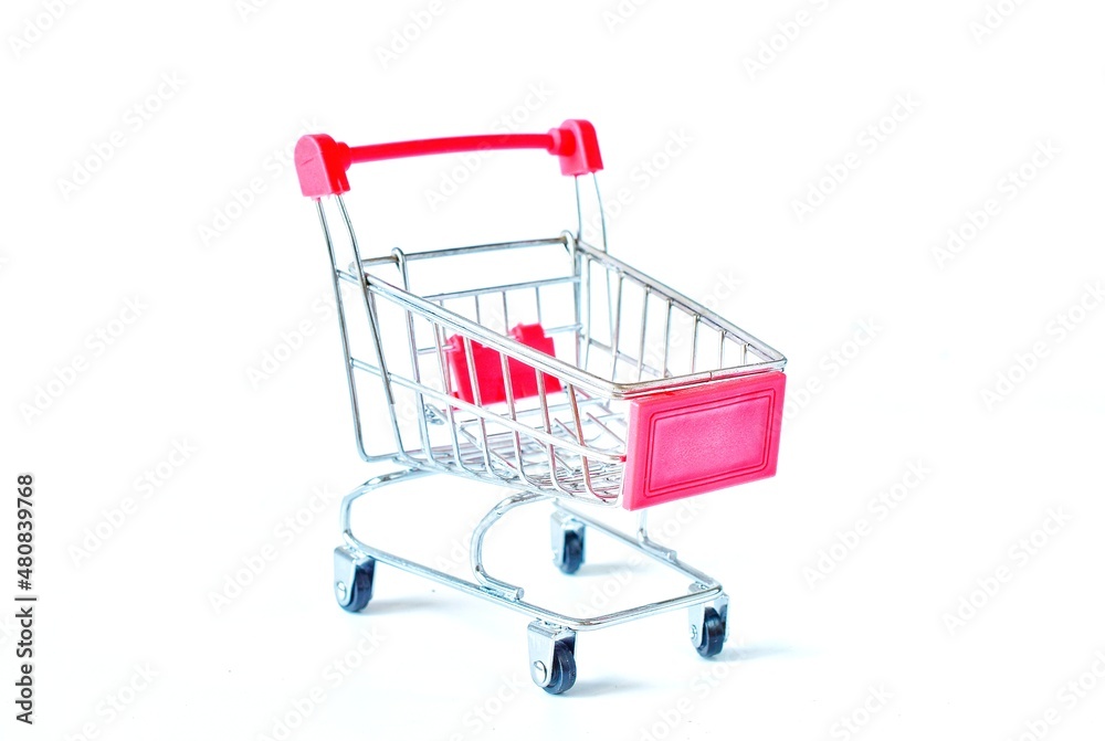Shopping cart in supermarket is empty on white background.