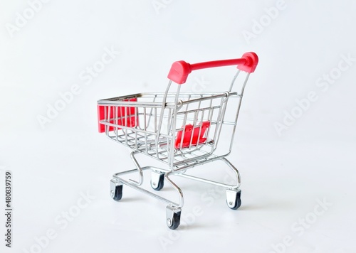 empty supermarket shopping cart isolated on white background © ประพันธ์ บุญเหมาะ