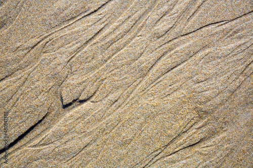Texture background of natural sand at the beach after low tide, nobody