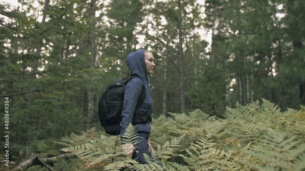 Traveler photographing scenic view in forest. One caucasian woman shooting nice magic look. Girl take photo video on dslr mirrorless camera. Traveler photographing scenic view in forest. One caucasian woman shooting nice magic look. Girl take photo video on dslr mirrorless camera.