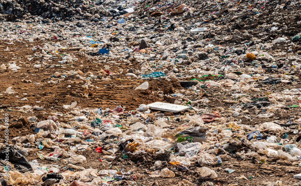 garbage dump pile in trash dump or landfill,truck is dumping the gabage from municipal,garbage dump pile and blue sky ,pollution concept garbage dump pile in trash dump or landfill,truck is dumping the gabage from municipal,garbage dump pile and blue sky ,pollution concept