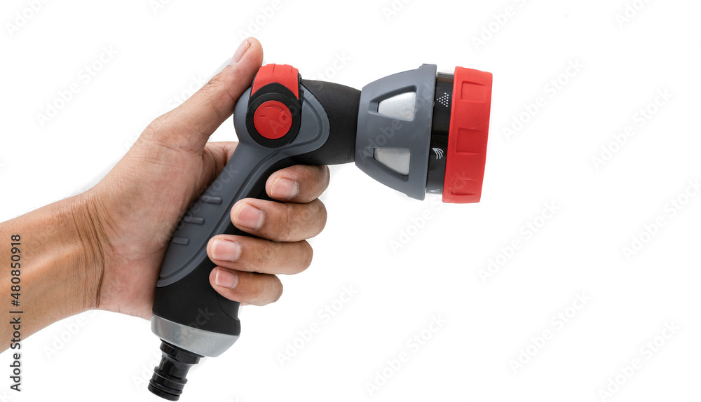 Hand holding water nozzle isolated on white background. Hand holding water nozzle isolated on white background.