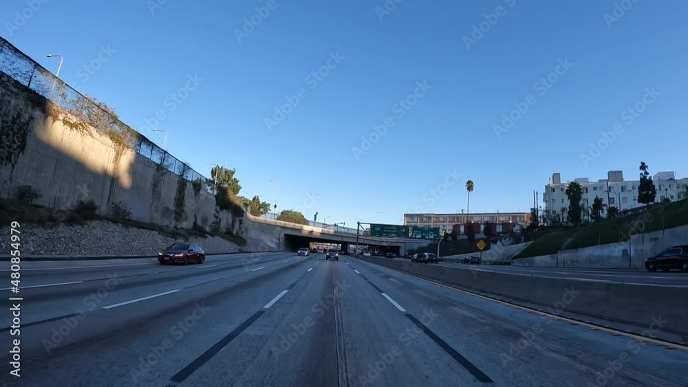 Driving along a highway in Los Angeles, California while looking out the rear window Driving along a highway in Los Angeles, California while looking out the rear window