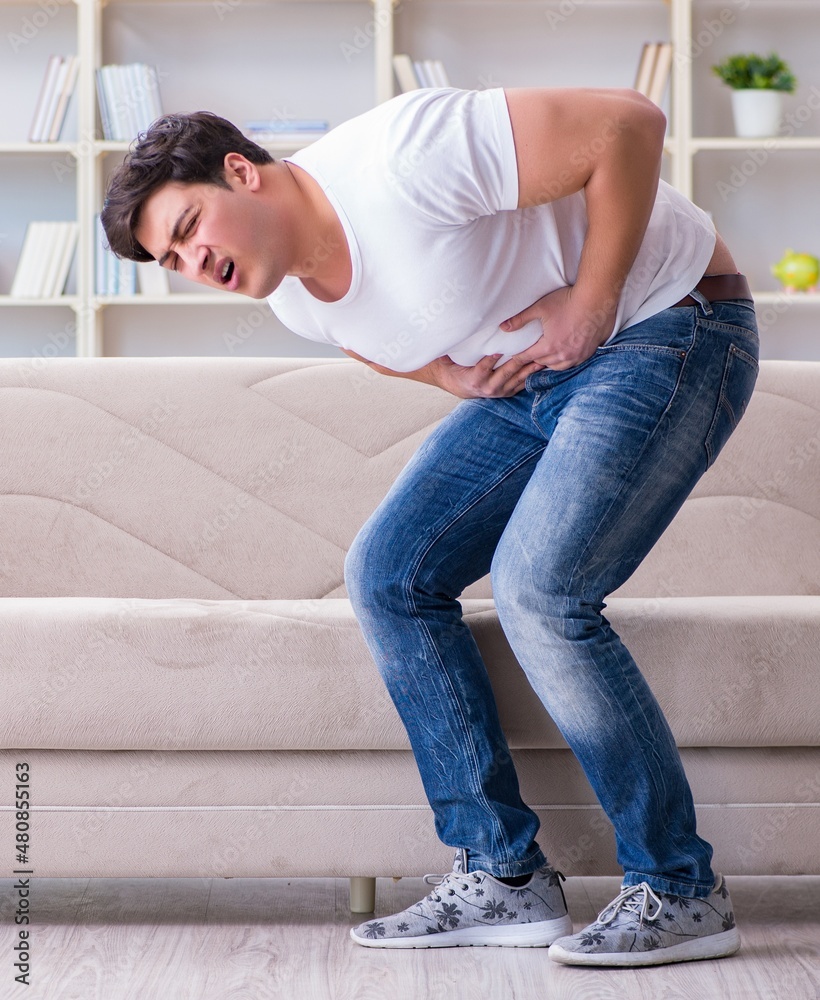 Man suffering from sick stomach and vomiting Man suffering from sick stomach and vomiting