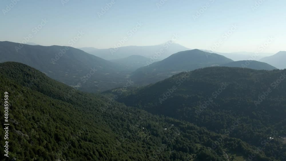 Dolly out of the mountains of southern chile on a sunny day with the villarrica volcano in the background - drone shot Dolly out of the mountains of southern chile on a sunny day with the villarrica volcano in the background - drone shot