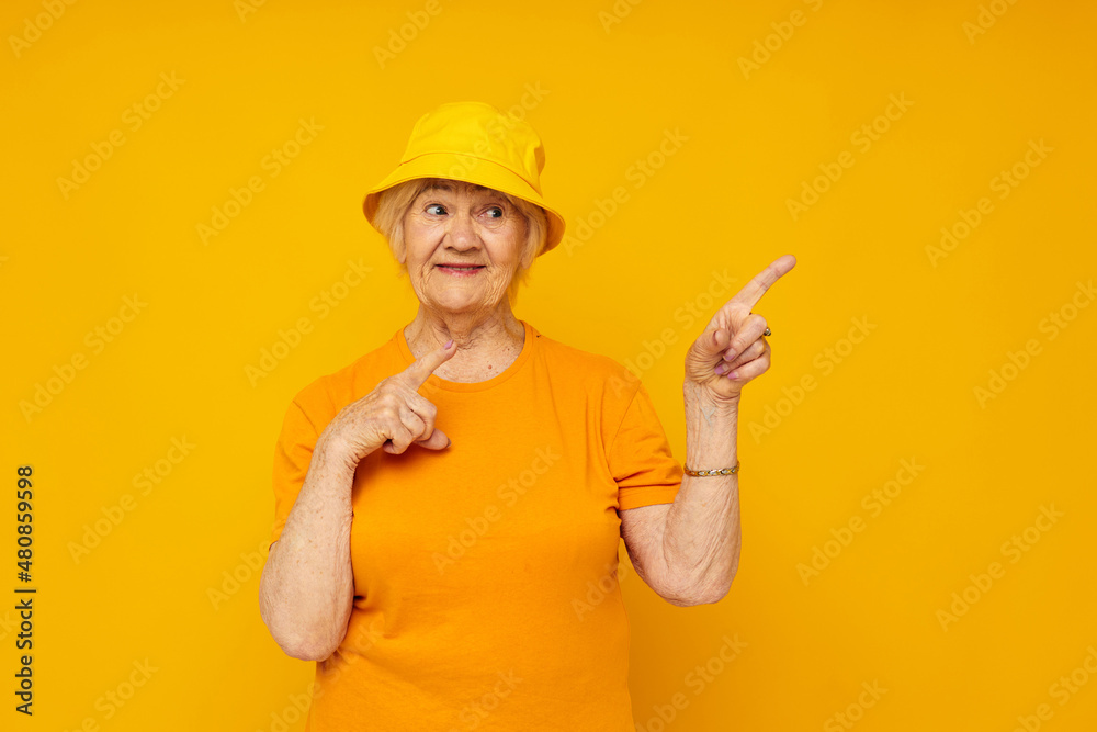Photo of retired old lady happy lifestyle in a yellow headdress close-up emotions