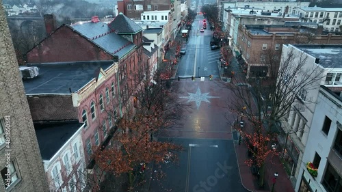 Bethlehem Pennsylvania decorated at Christmas. Moravian Star painted on road. Rising aerial. photo