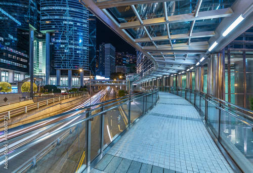 Photography Night scenery of modern pedestrian walkway in downtown district of Hong Kong cit