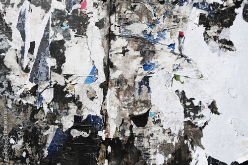 Obraz na plátně Old ripped torn advertising poster fragments, stripped wall placard leavings