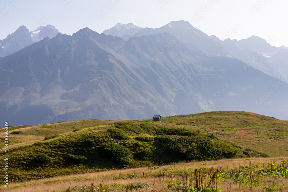 Naklejka premium Amazing view from the Tskahazagari peak on the Svaneti mountain peaks near Mestia in the Greater Caucasus Mountain Range, Upper Svaneti,Country of Georgia.Hiking trail to the Koruldi Lakes.Cottage,hut
