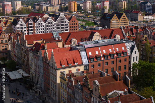 Gdansk, Poland Historical brick colorful building, red roofs and Baltic sea canal. Sunny day, spring time. Aerial view.