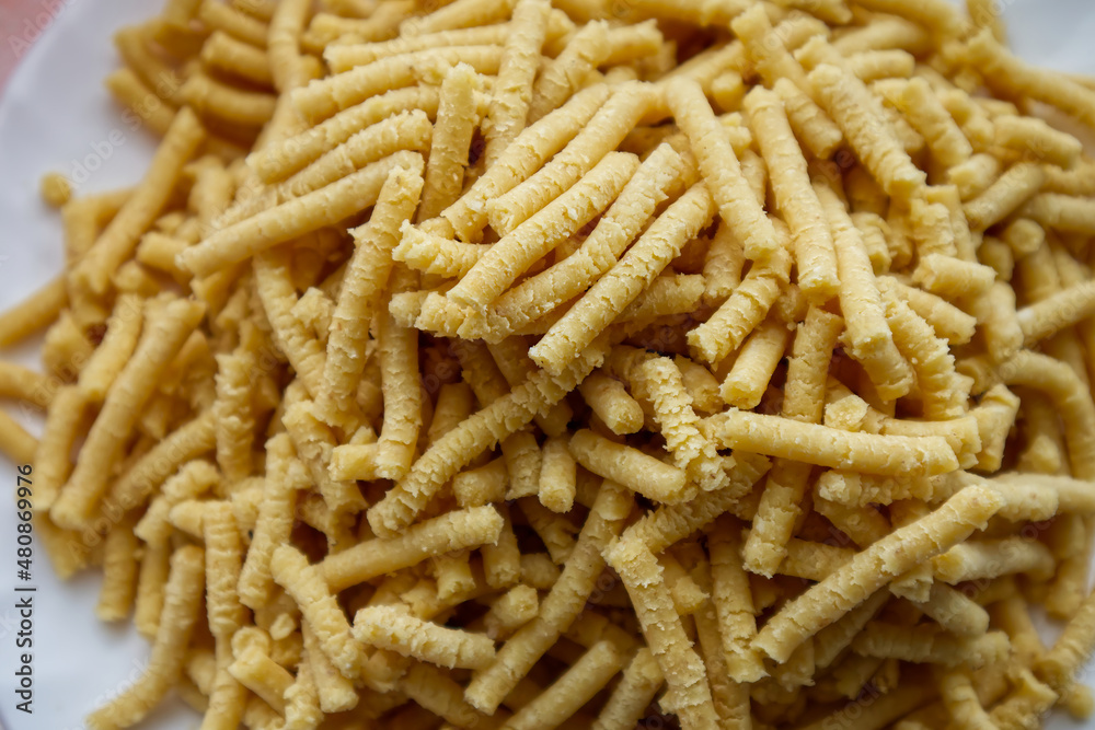 Raw homemade Passatelli. Traditional Italian pasta usually cooked in broth. Close up