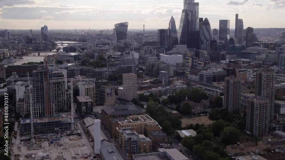 Zoom shot from aerial drone of trains rising up to reveal The Shard in London, UK Zoom shot from aerial drone of trains rising up to reveal The Shard in London, UK
