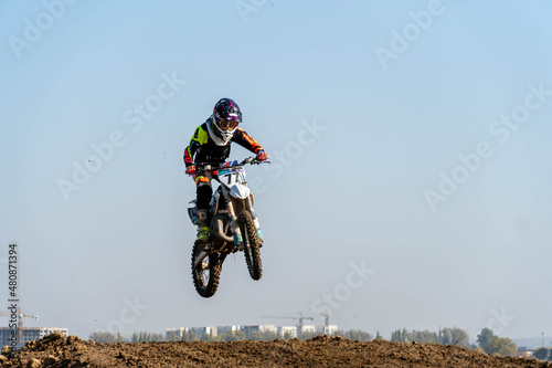 jumping on a motorcycle. motocross. motorcycle racing. bikers on the track