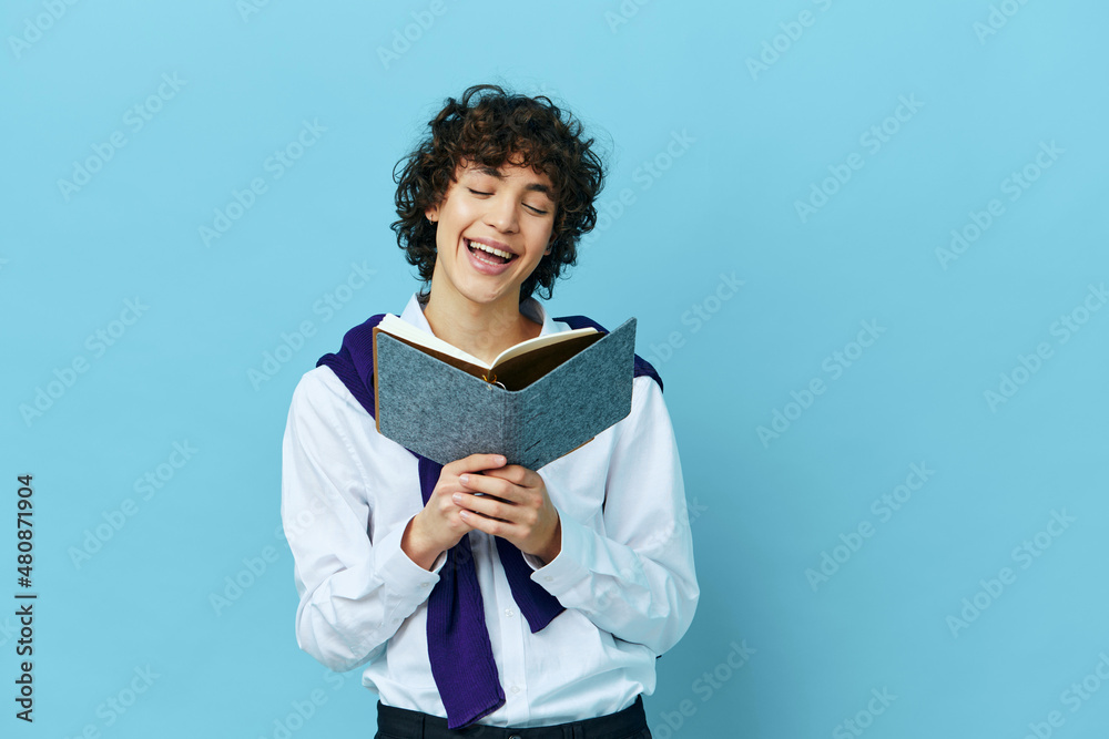 student with a book college learning jacket blue background student with a book college learning jacket blue background