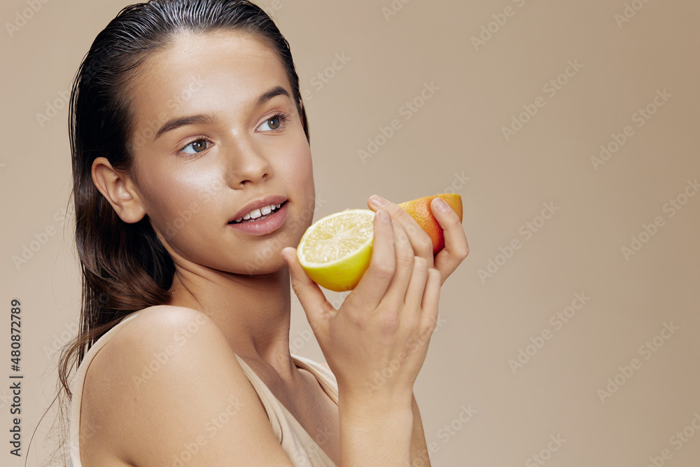 woman grapefruit with lemon in hands smile vitamins close-up Lifestyle woman grapefruit with lemon in hands smile vitamins close-up Lifestyle