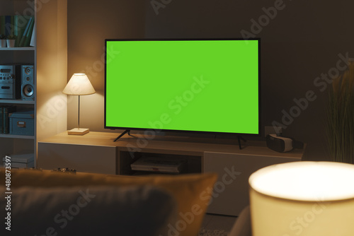 Television with horizontal green screen in the living room © stokkete