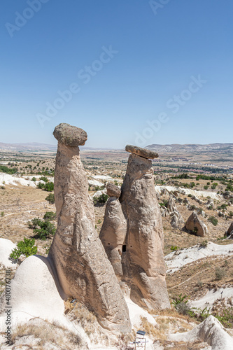 Beautiful view of the valley of love in Cappadocia with mountain peaks in the summer day. Vertical