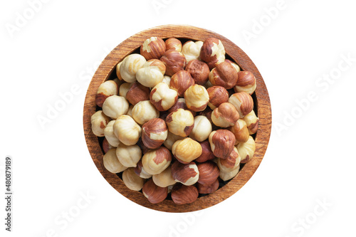 hazelnut peeled roasted in wooden bowl isolated on white background. Vegan food, top view.