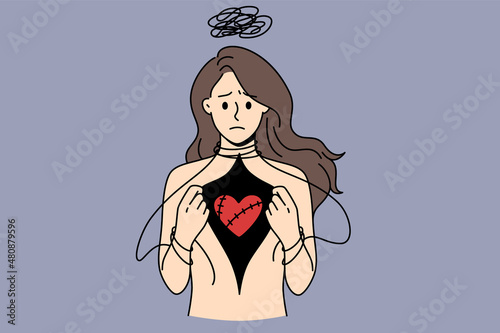 Depression and love hurting concept. Stressed depressed woman standing and showing her red injured heart in breast vector illustration 